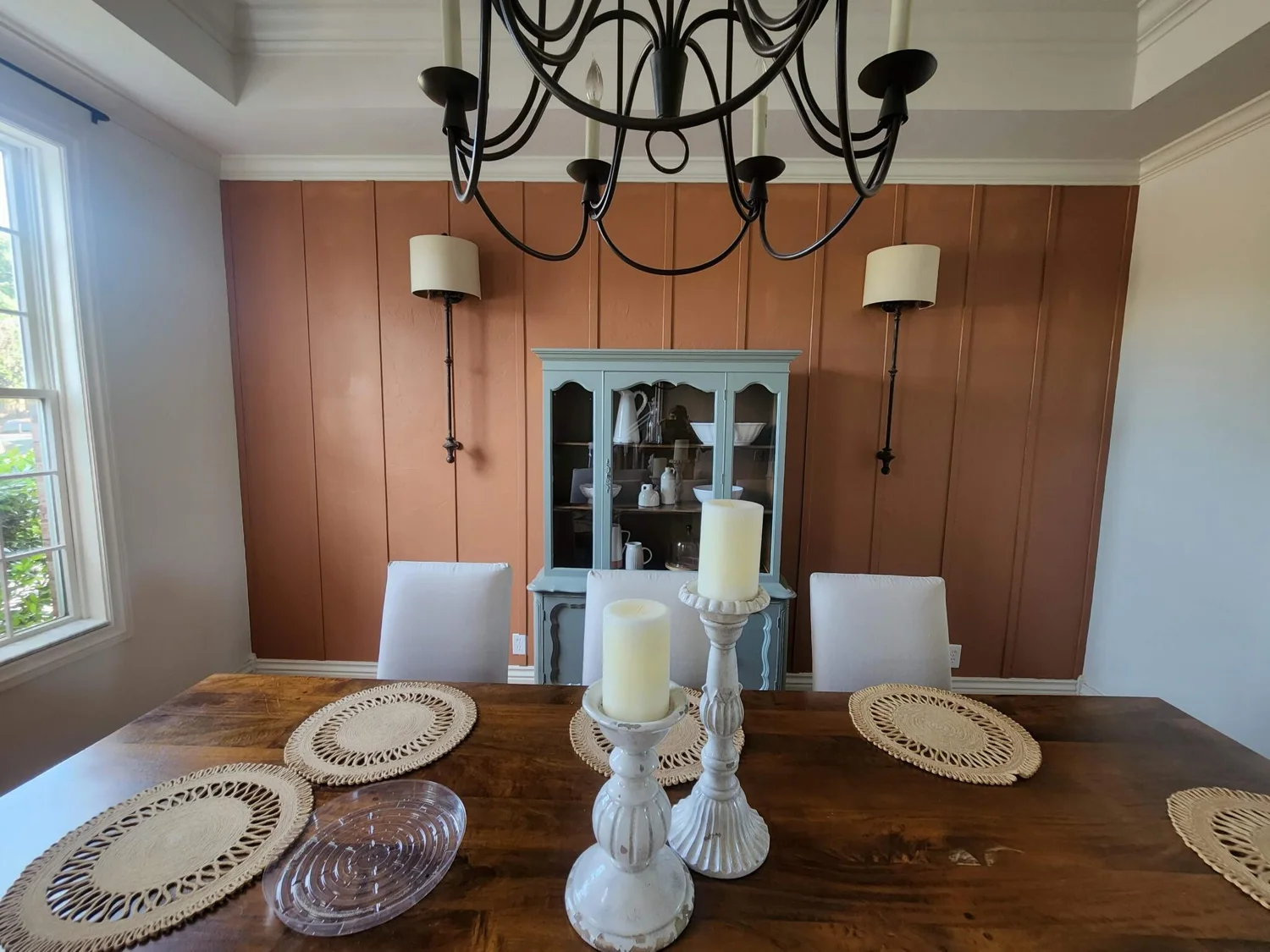 Dining room with a warm wood feature wall